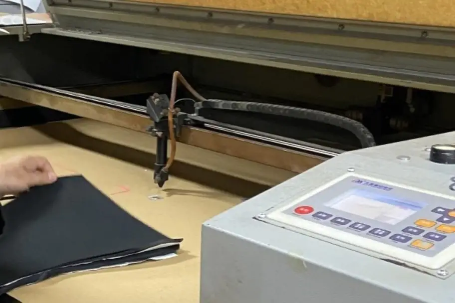 operating a laser cut machine in clothing manufacturing